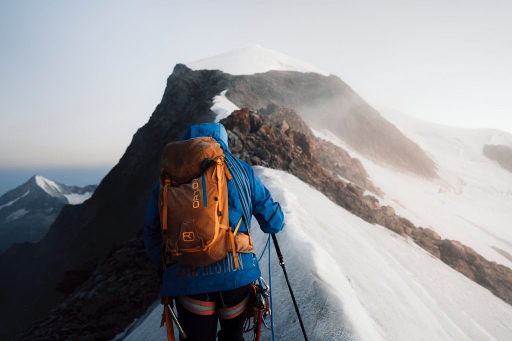 Mountaineer On Mountain Peak Climbing In Nepal